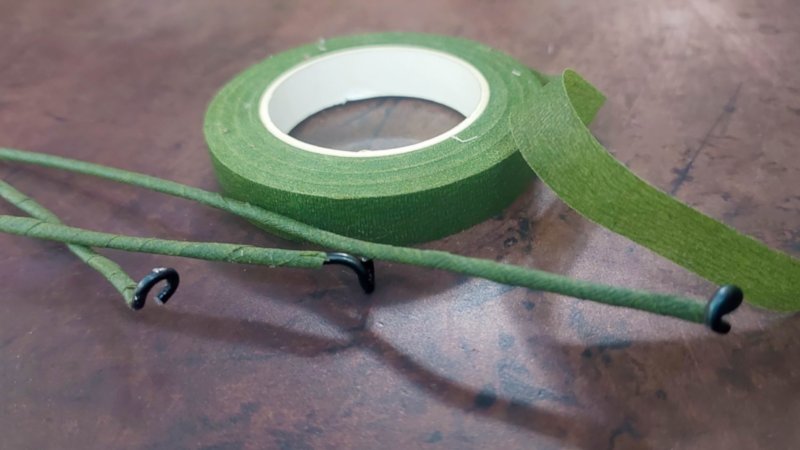 Wrap the jewelry wire in florist tape
