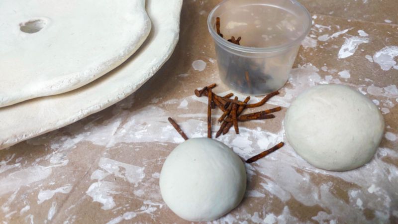 The clay dome flower center and rusty nails