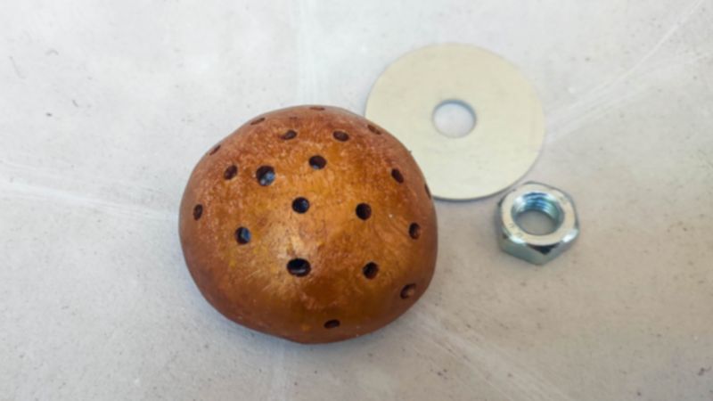 Make hole in clay dome center.