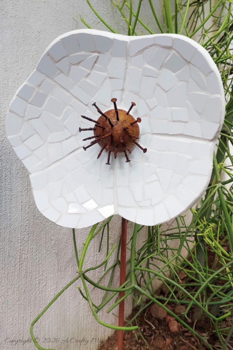 If you&rsquo;ve got a stash of old tiles and hardware lying around, this oversized mosaic flower project is such a fun way to turn them into weather‑friendly garden art that even the dog can&rsquo;t destroy.