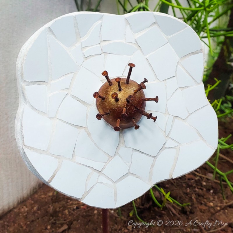 If you&rsquo;ve got a stash of old tiles and hardware lying around, this oversized mosaic flower project is such a fun way to turn them into weather‑friendly garden art that even the dog can&rsquo;t destroy.