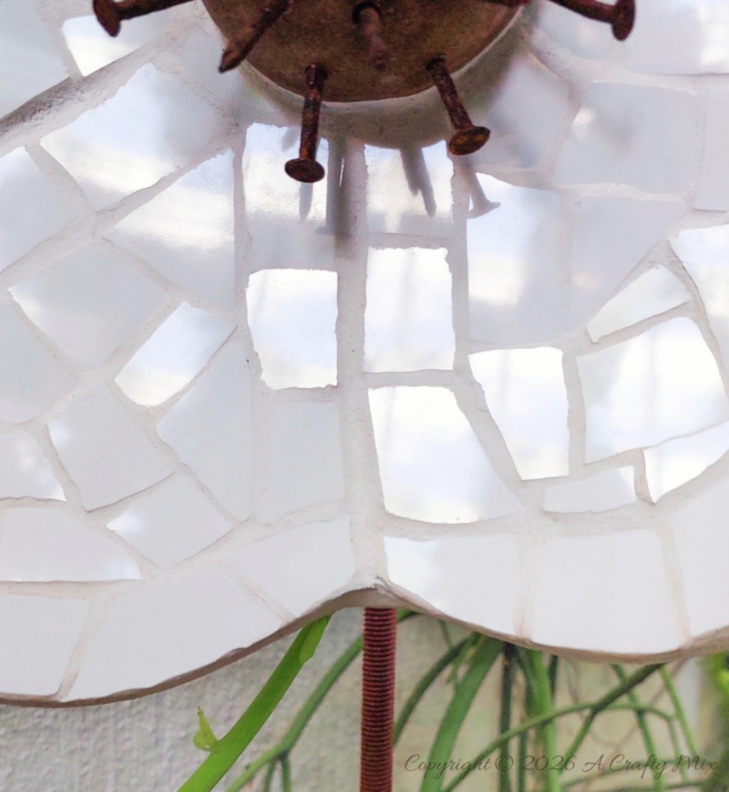 If you&rsquo;ve got a stash of old tiles and hardware lying around, this oversized mosaic flower project is such a fun way to turn them into weather‑friendly garden art that even the dog can&rsquo;t destroy.