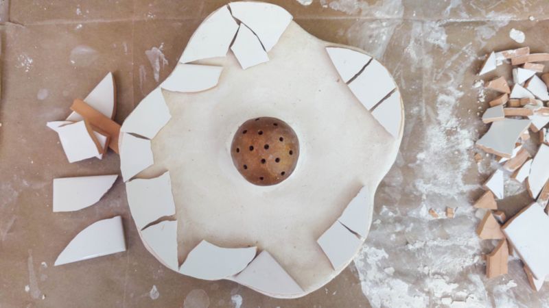 Start laying the tiles around the outside edges first