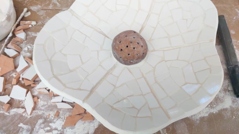 The mosaic flowers after applying the tiles