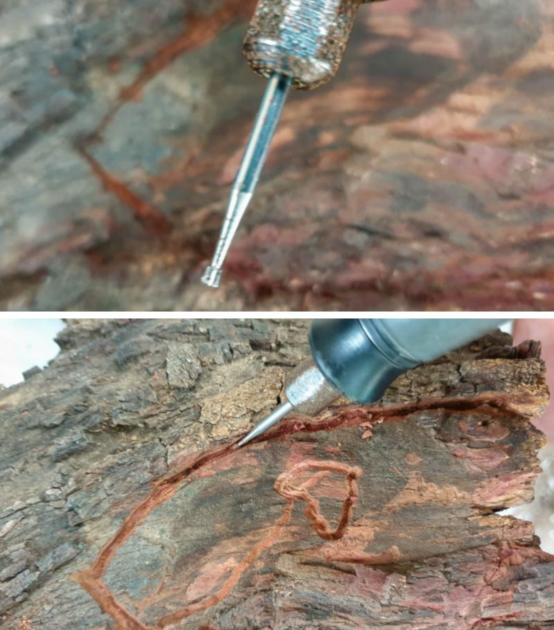 Carving the Medieval fairy door outline into the stump