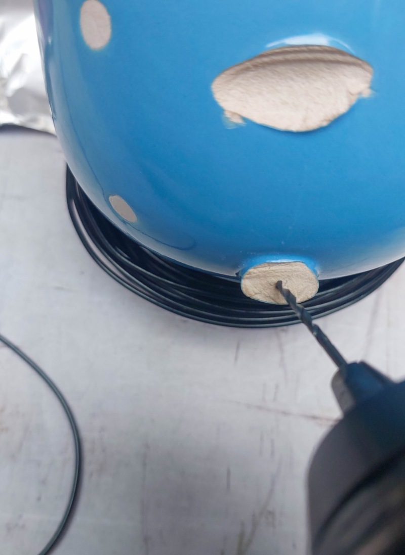 Drill a small hole in the broken mug