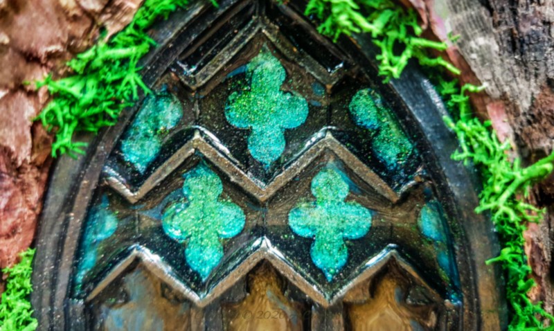 Come see how to make this magical medieval fairy door with a faux stained-glass effect using a silicone mold and paint. This easy fairy garden DIY is perfect for adding a tiny storybook doorway to your yard. Save this idea for your next weekend craft.