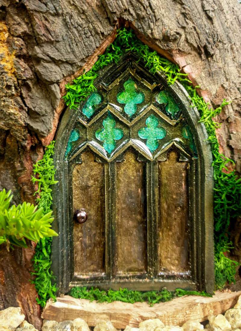 Come see how to make this magical medieval fairy door with a faux stained-glass effect using a silicone mold and paint. This easy fairy garden DIY is perfect for adding a tiny storybook doorway to your yard. Save this idea for your next weekend craft.