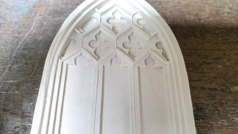 Gently remove the medieval fairy door from the mold after baking