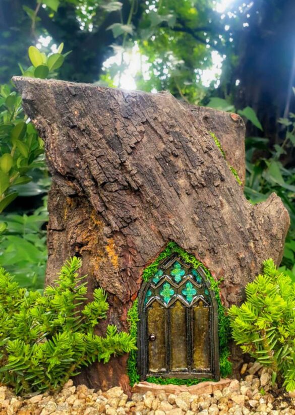 Come see how to make this magical medieval fairy door with a faux stained-glass effect using a silicone mold and paint. This easy fairy garden DIY is perfect for adding a tiny storybook doorway to your yard. Save this idea for your next weekend craft.