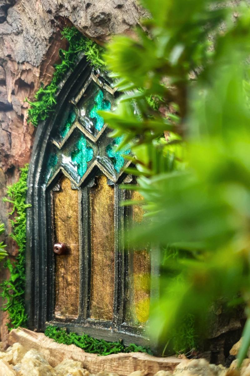 Come see how to make this magical medieval fairy door with a faux stained-glass effect using a silicone mold and paint. This easy fairy garden DIY is perfect for adding a tiny storybook doorway to your yard. Save this idea for your next weekend craft.