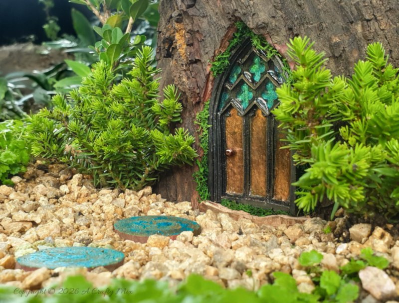 Come see how to make this magical medieval fairy door with a faux stained-glass effect using a silicone mold and paint. This easy fairy garden DIY is perfect for adding a tiny storybook doorway to your yard. Save this idea for your next weekend craft.