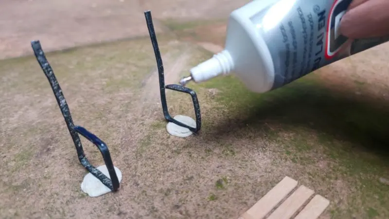 Glue the back and seat onto the wire legs