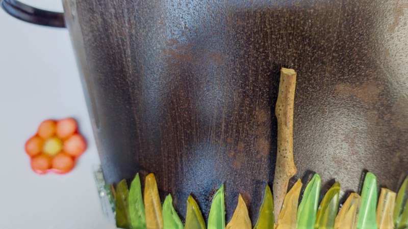 Glue the twigs in between the tiles