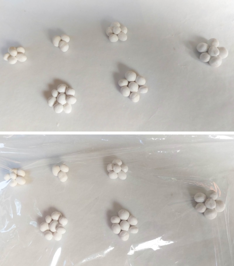 Make a whole bunch of clay balls and arrange them into flower shapes