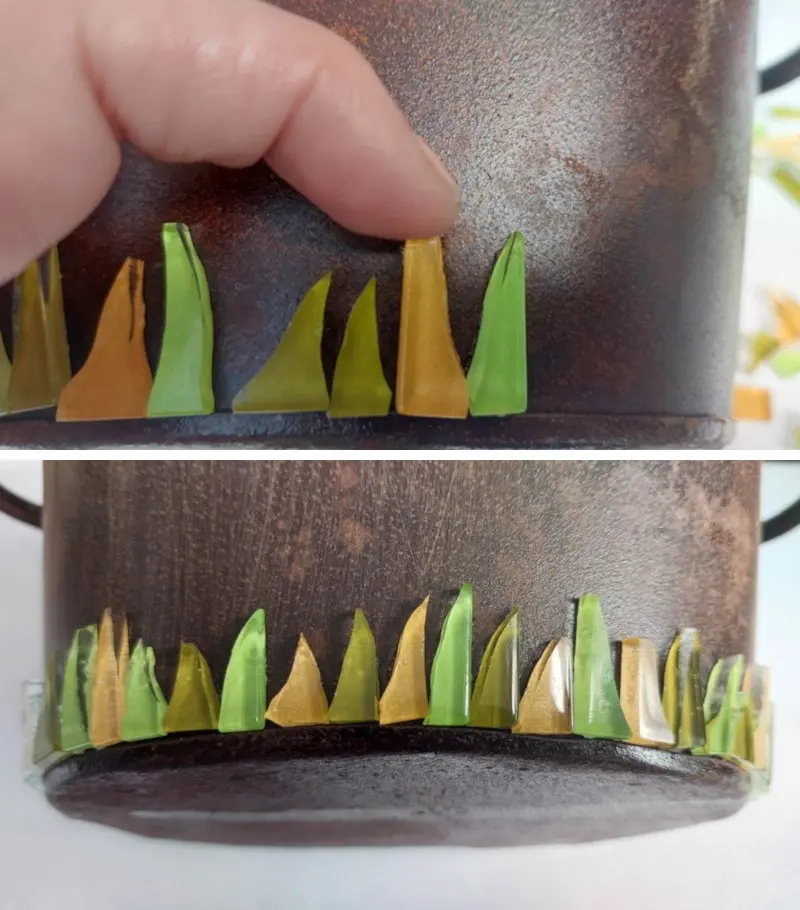 Glue the mosaic tiles around the bottom of the planter