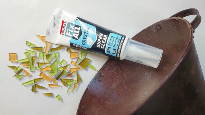 Tile offcuts, a rusty planter and water resistant glue