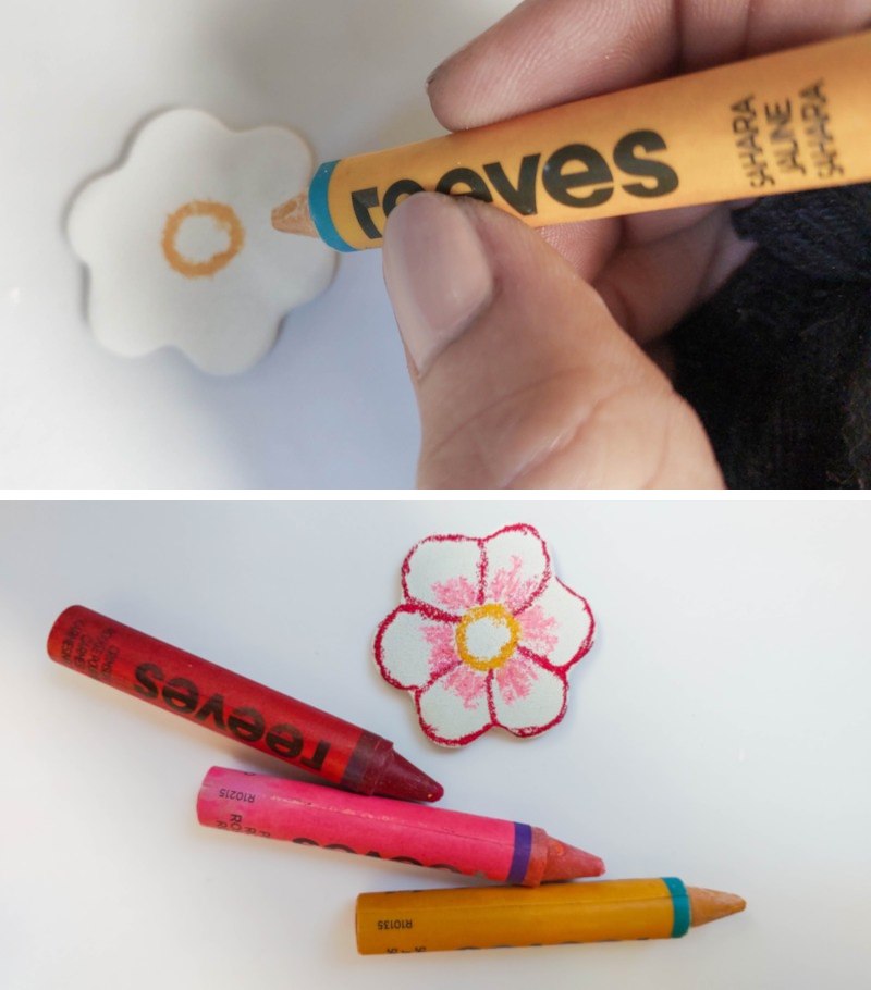 Color the baked or cured flowers in with wax crayons