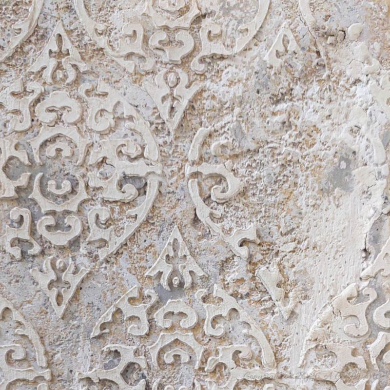 A close up view of the damask texture on top of distress paint layers