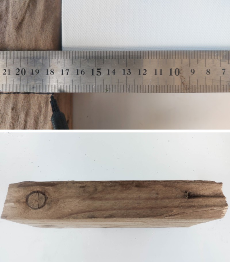 A block of wood and ruler lying next to a box canvas that will be used to make the floating shelf