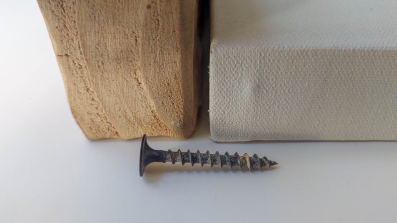 A side view of the box canvas, shelf, and short screw