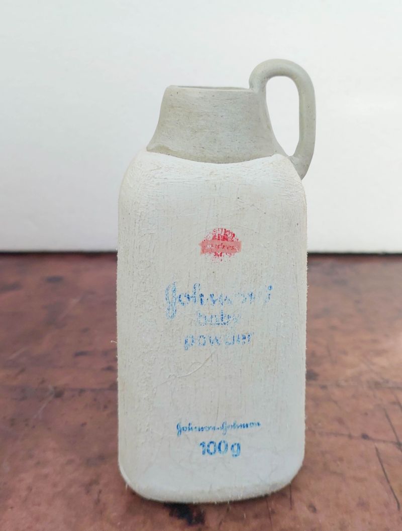 A WIP image of a baby powder bottle being transformed into a vase.