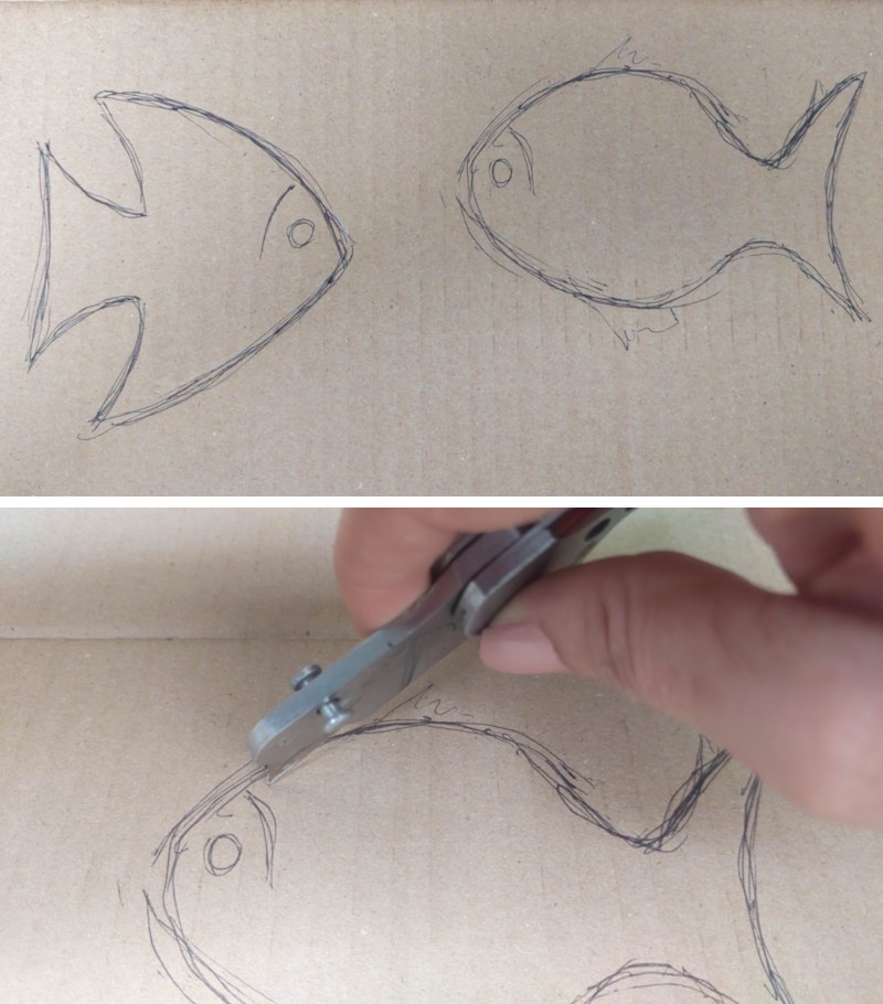 A process shot showing simple fish shapes and a hand cutting the shapes out with a craft knife