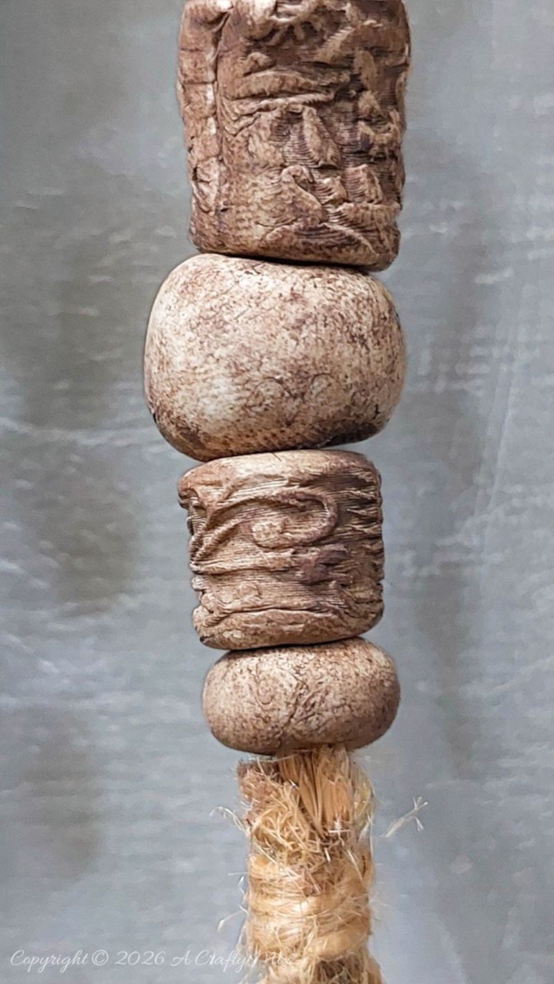 Close up of rustic clay beads that look old and worn
