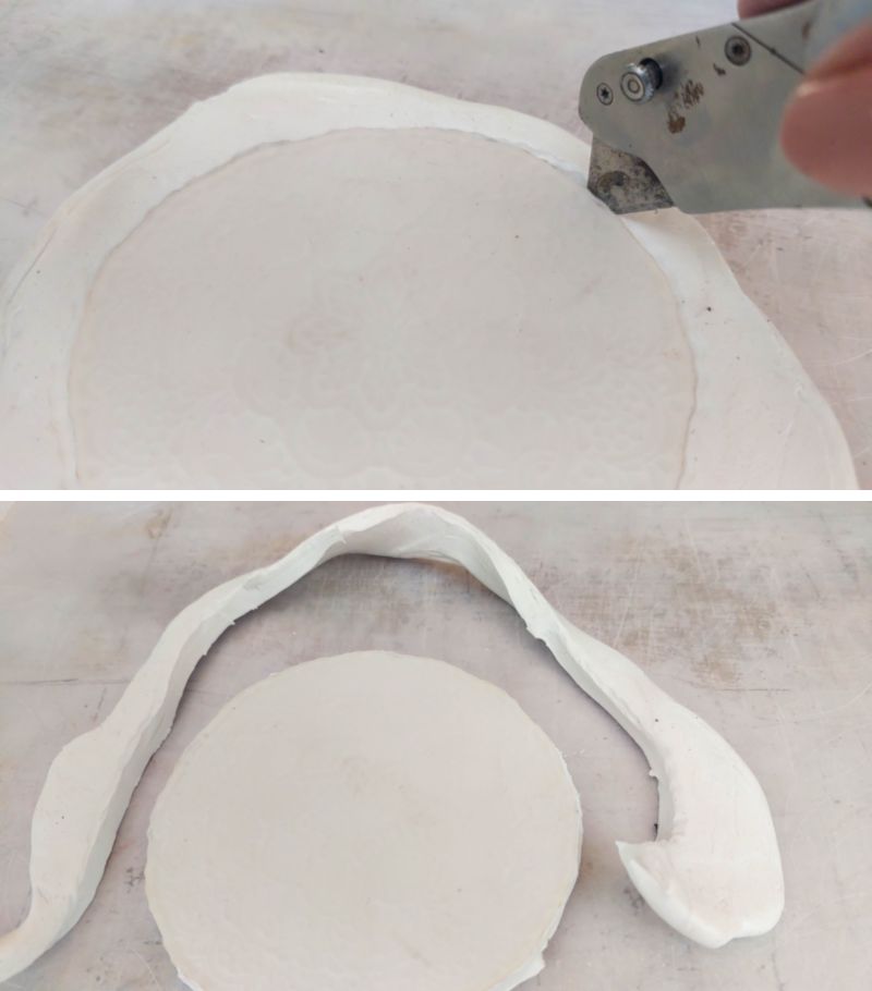 A vertical image showing a craft knife cutting away excess clay