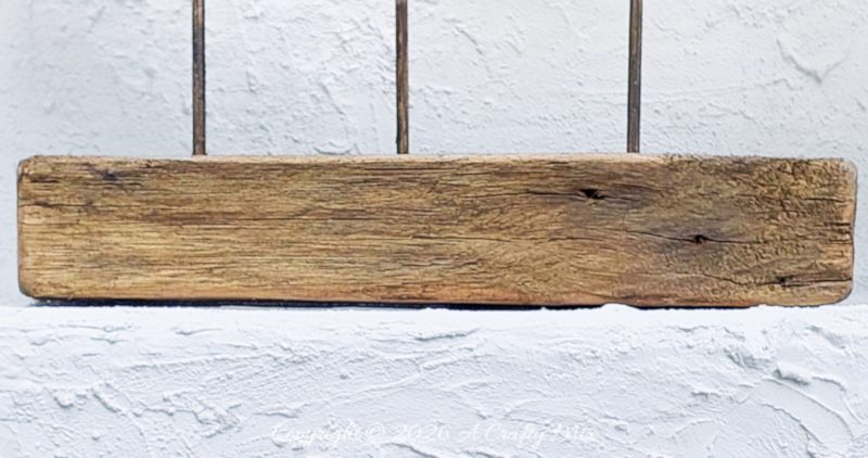 A close up shot of the wooden base used in the coastal fish decor