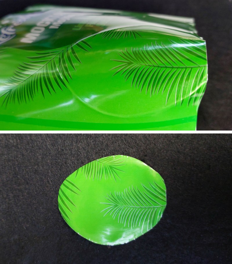 Two‑step photo showing a green soda can sheet with leaf print and the rounded body shape for a soda can bird cut out from it.