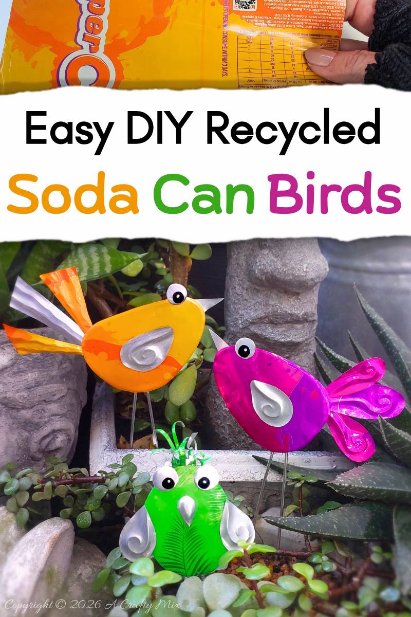 Orange, pink and green recycled Soda Can Birds on wire legs decorating potted plants in a small garden.
