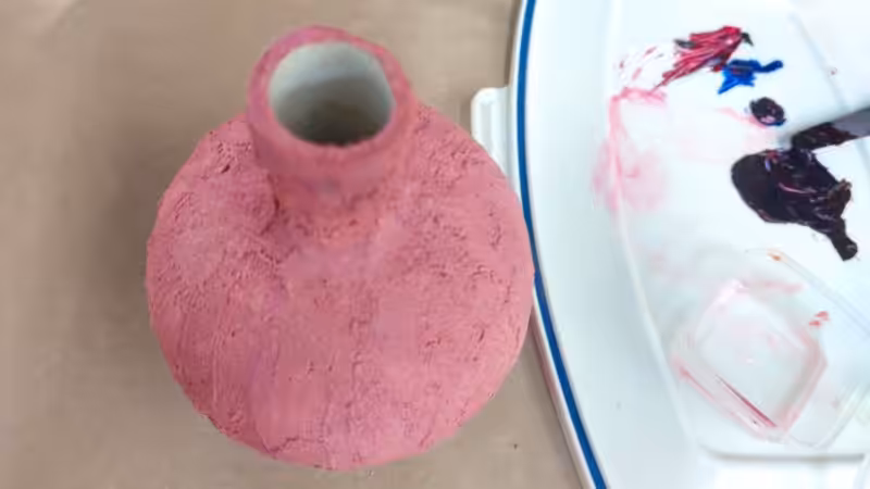Paint the upcycled vase a berry color