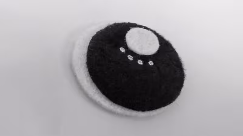 Make large eyes for the whimsical bat out of black and white felt