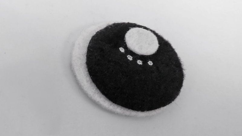 Make large eyes for the whimsical bat out of black and white felt
