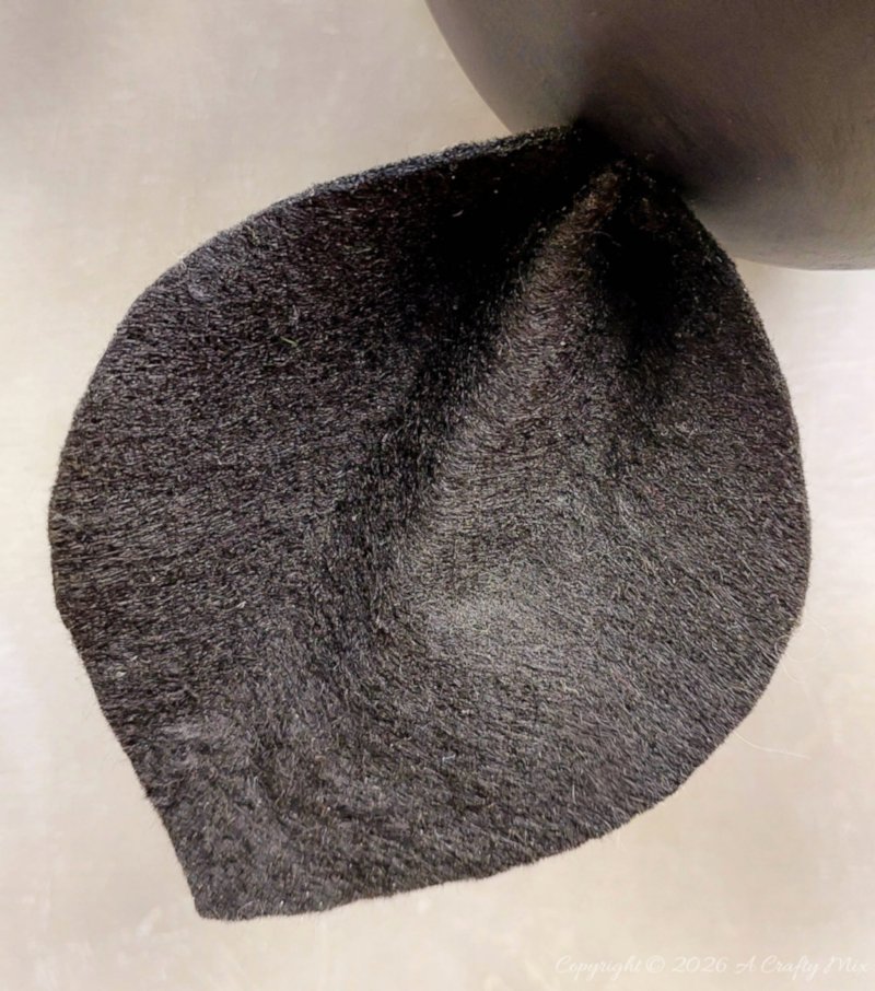 Make large floppy bat ears out of felt