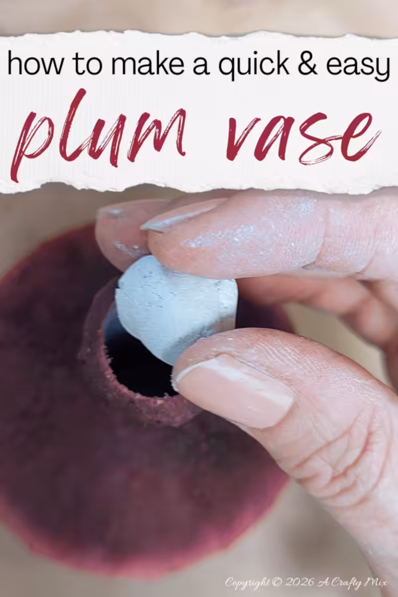Hand holding a ball of white epoxy clay above the neck opening of a Plum Noir DIY vase under the text ‘how to make a quick & easy plum vase’.