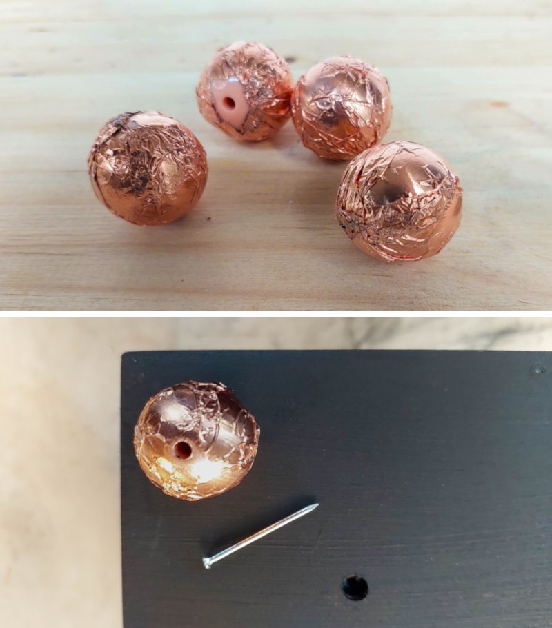 Four copper balls are nailed into the bottom of the planter