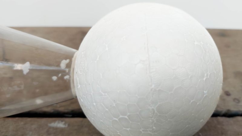Polystyrene is made up of tiny beads fused together to form a shape. If you look closely, the surface is pebbly and uneven, and if you paint it, those gaps show up as little pits.