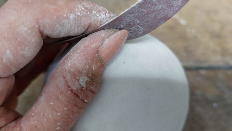 Use 120-grit sandpaper to smooth out the texture paste
