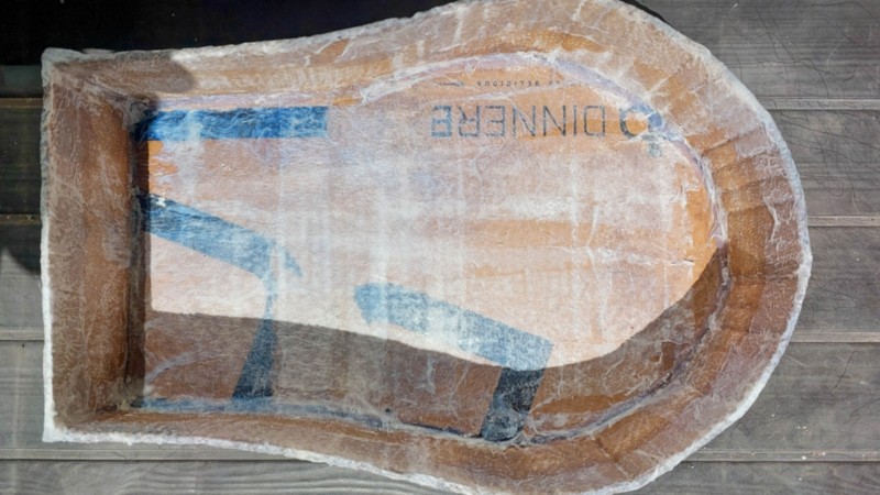 Mod podge paper napkin all over the cardboard sarcophagus