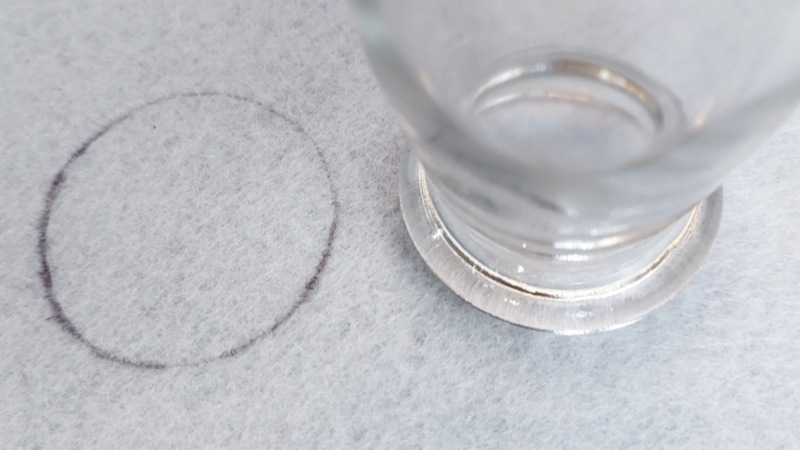 Draw a round shape on white felt