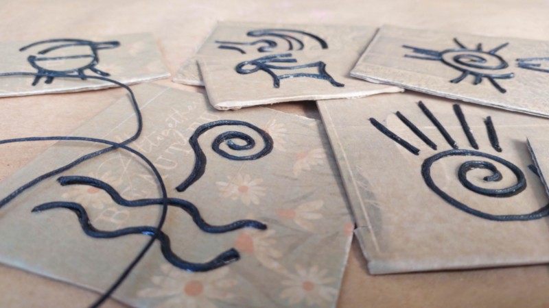 A collection of cardboard petroglyphs