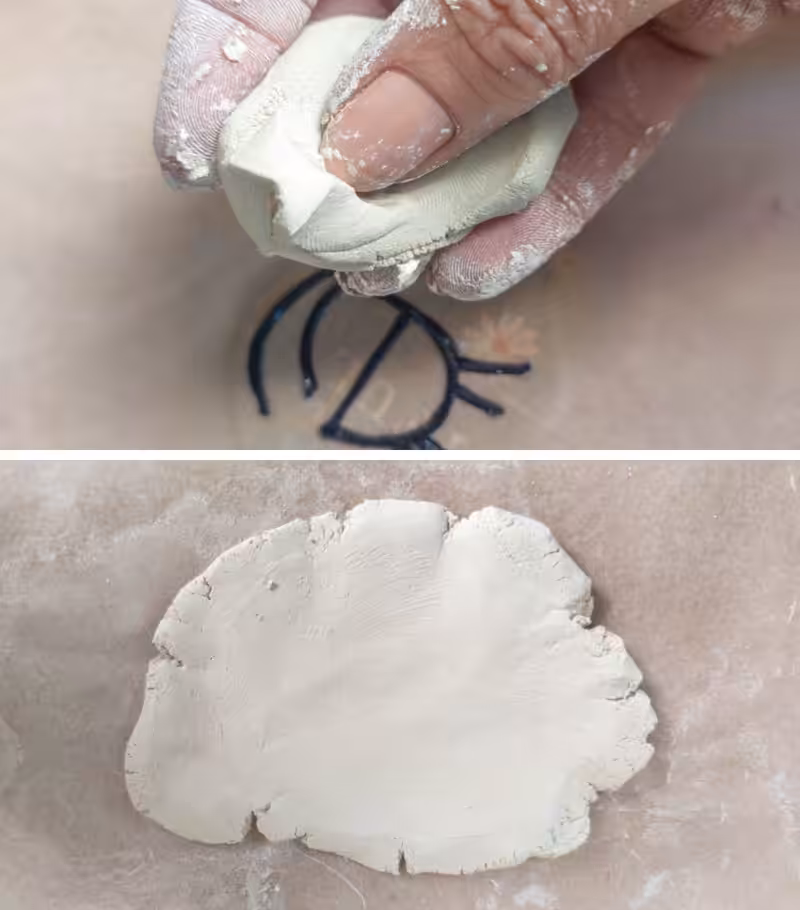 A hand conditioning clay and forming it into a flattened disc