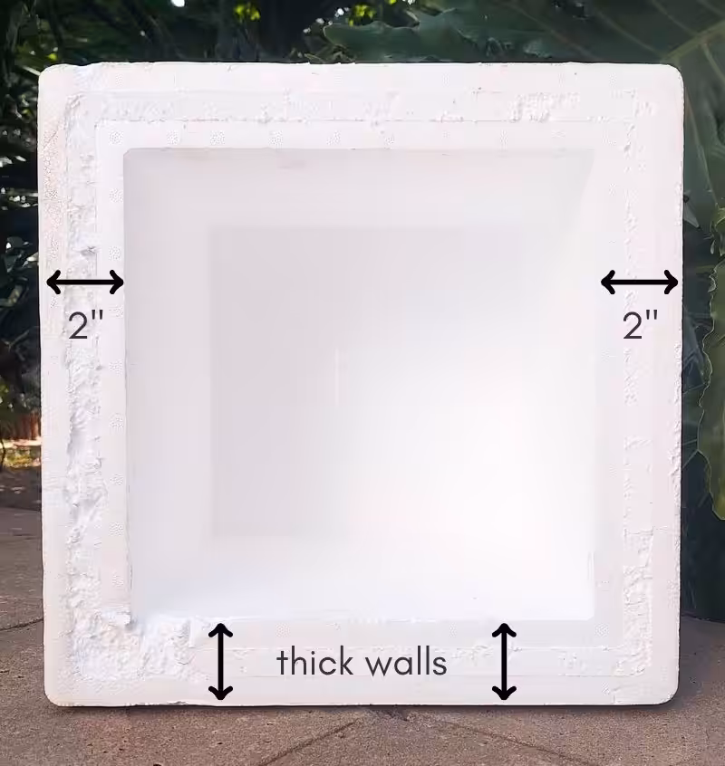 A white EPS Foam cooler with measurements written on the side walls