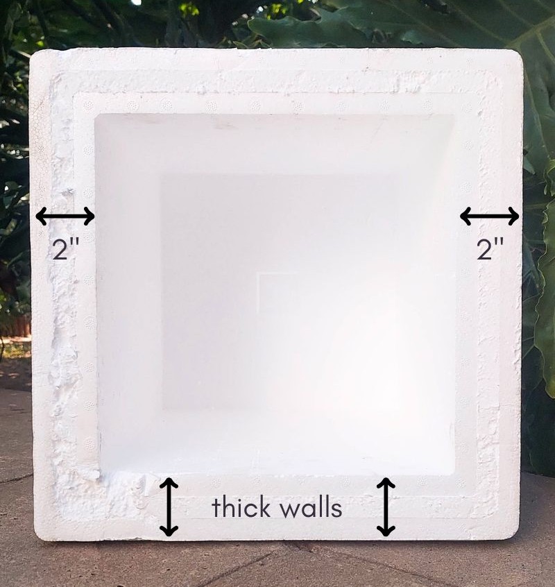 A white EPS Foam cooler with measurements written on the side walls