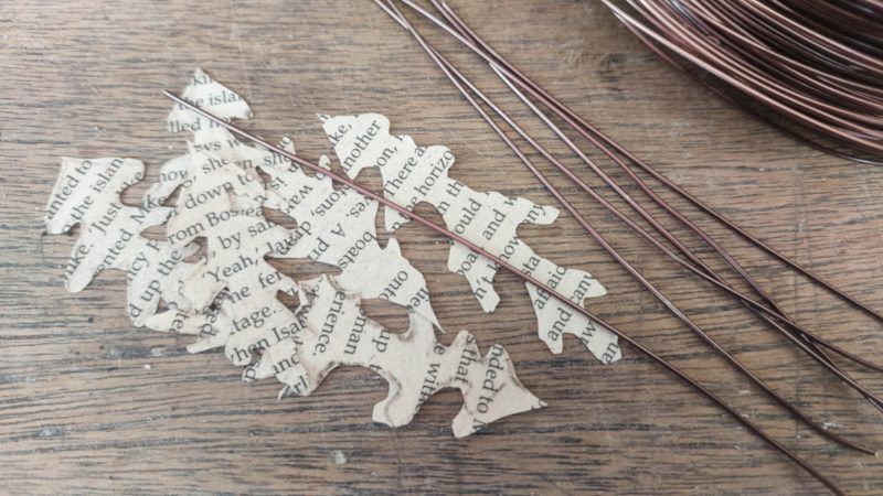 Cut oak shaped leaves out of book pags