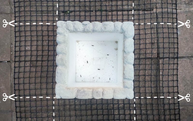 A white cooler sits on top of a wire mesh with cutting instructions on the sides