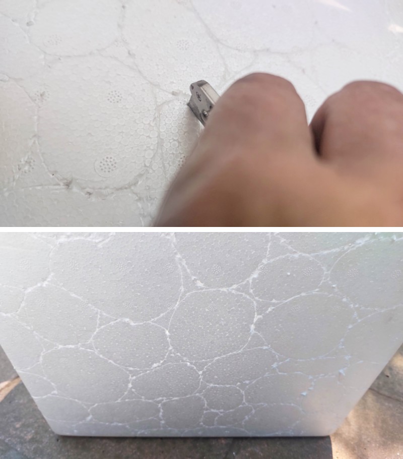 A hand drawing basic pebble shapes on an EPS foam cooler