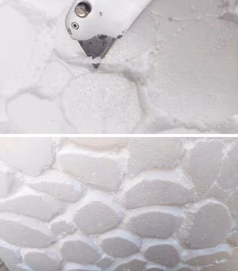 Close ups of a craft knife cutting pebble shapes in a cooler box